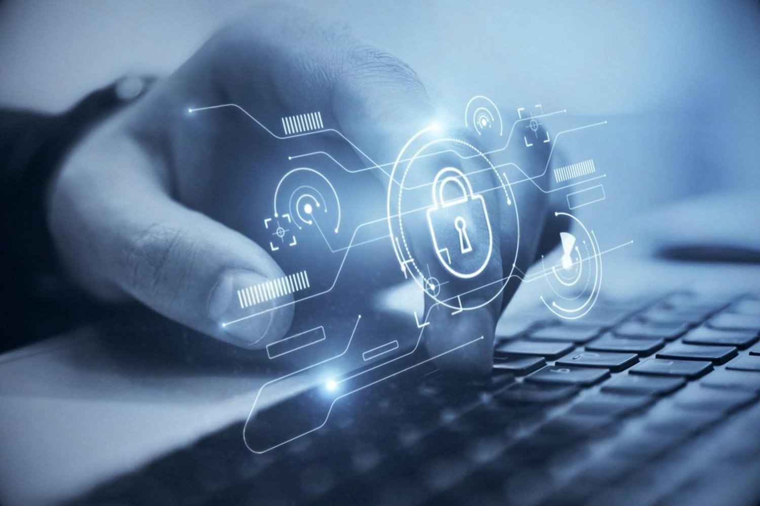 Hand on a laptop keyboard with a digital padlock representing secure .ae domain registration